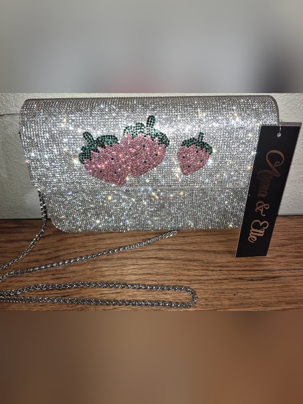 NWT's Rhinestone-encrusted silver clutch from the brand Anna & Elle, Strawberry